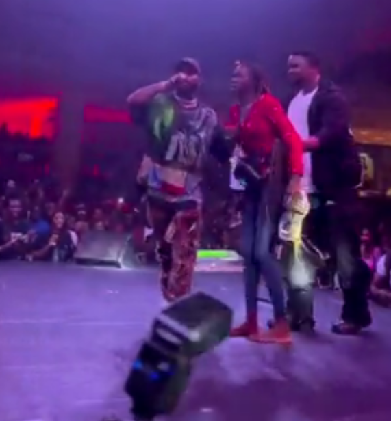 Fans react as Davido gifts fan shoes & N2m on stage (video)