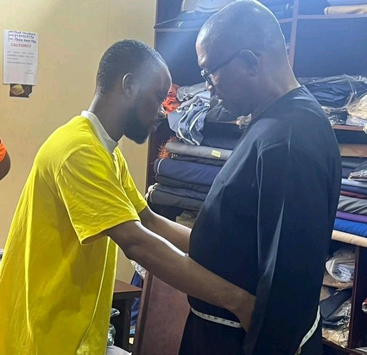 Photo of Peter Obi Having His Measurements Taken by a Man Triggers Mixed Reactions Online