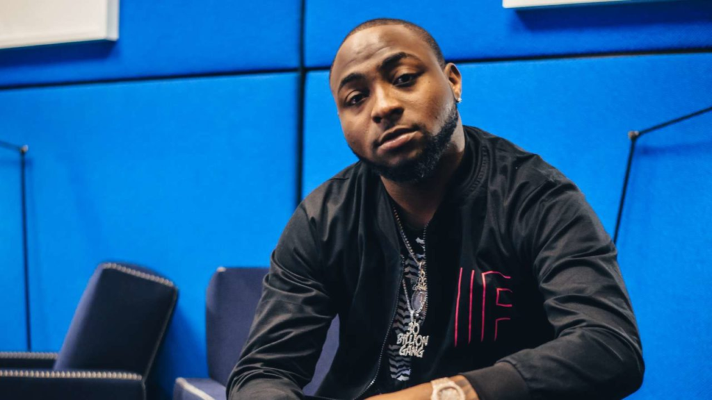 Reaction from fans after Davido's aide reportedly assaults fan attempting to take a photo with him